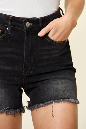 a close up of a person wearing black shorts