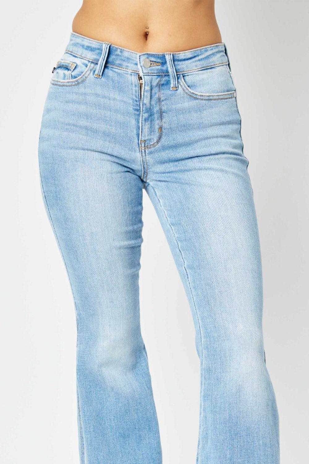 a woman is wearing a pair of blue jeans