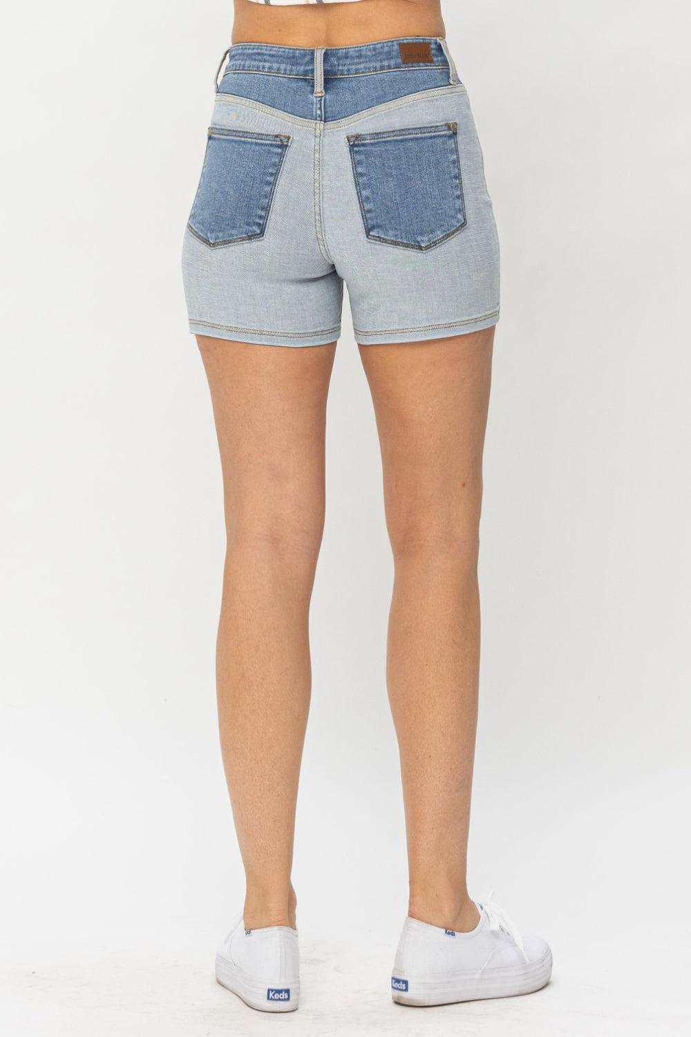 the back of a woman's jeans shorts