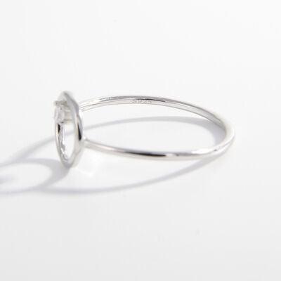 a white gold ring with a single diamond