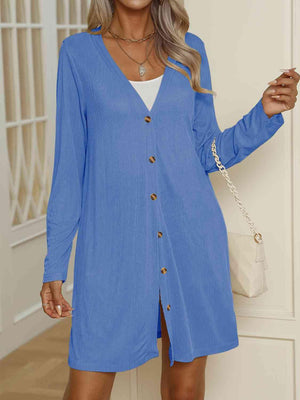 a woman wearing a blue shirt dress