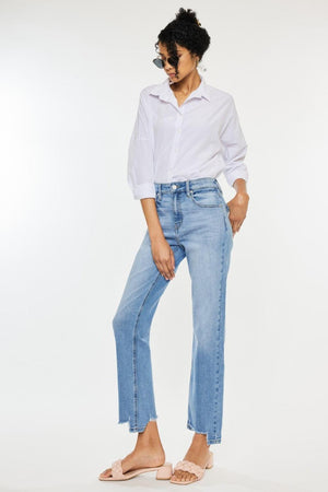 a woman in a white shirt and jeans