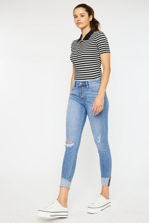 a woman in a striped shirt and jeans