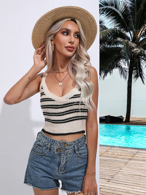 a woman wearing a straw hat standing next to a pool