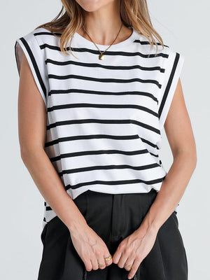 a woman wearing a black and white striped top