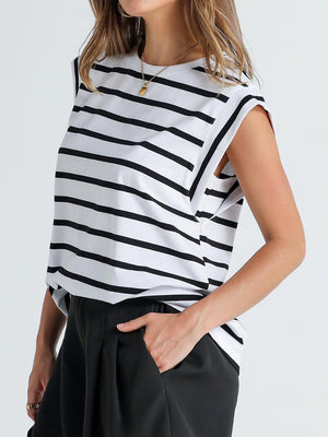 a woman wearing a black and white striped top