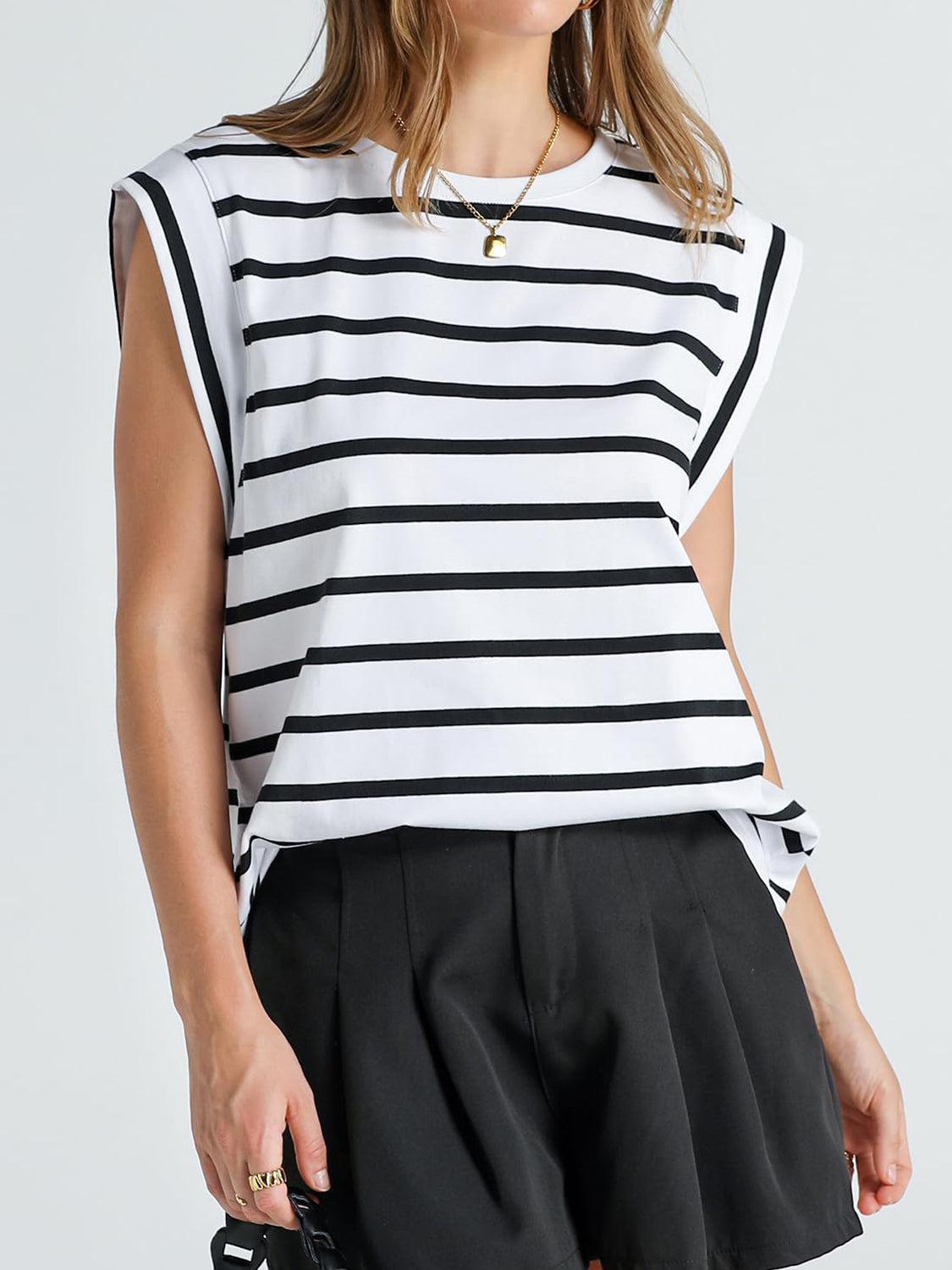 a woman wearing a black and white striped top