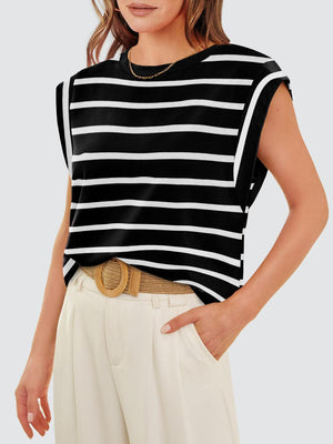 a woman wearing a black and white striped top