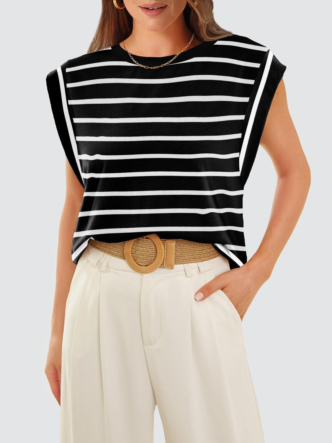 a woman wearing a black and white striped top