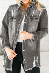 a woman wearing a denim jacket with holes