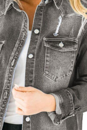 a woman wearing a jean jacket and jeans