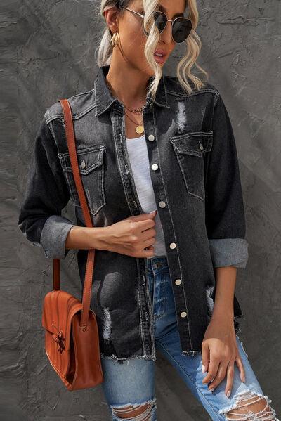 a woman wearing a denim jacket and ripped jeans