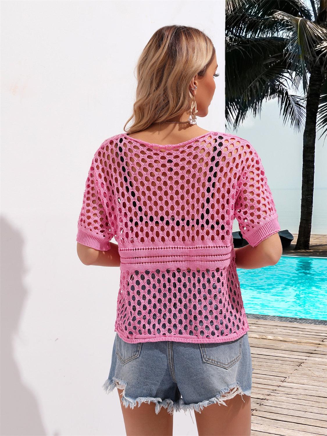 a woman standing next to a pool wearing a pink top