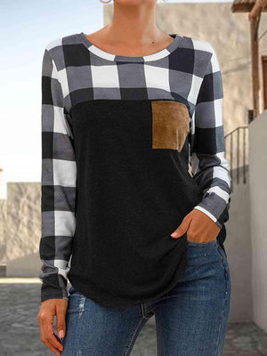 a woman wearing a black and white checkered top