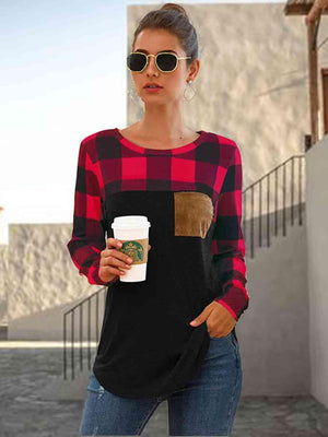 a woman holding a cup of coffee and wearing sunglasses