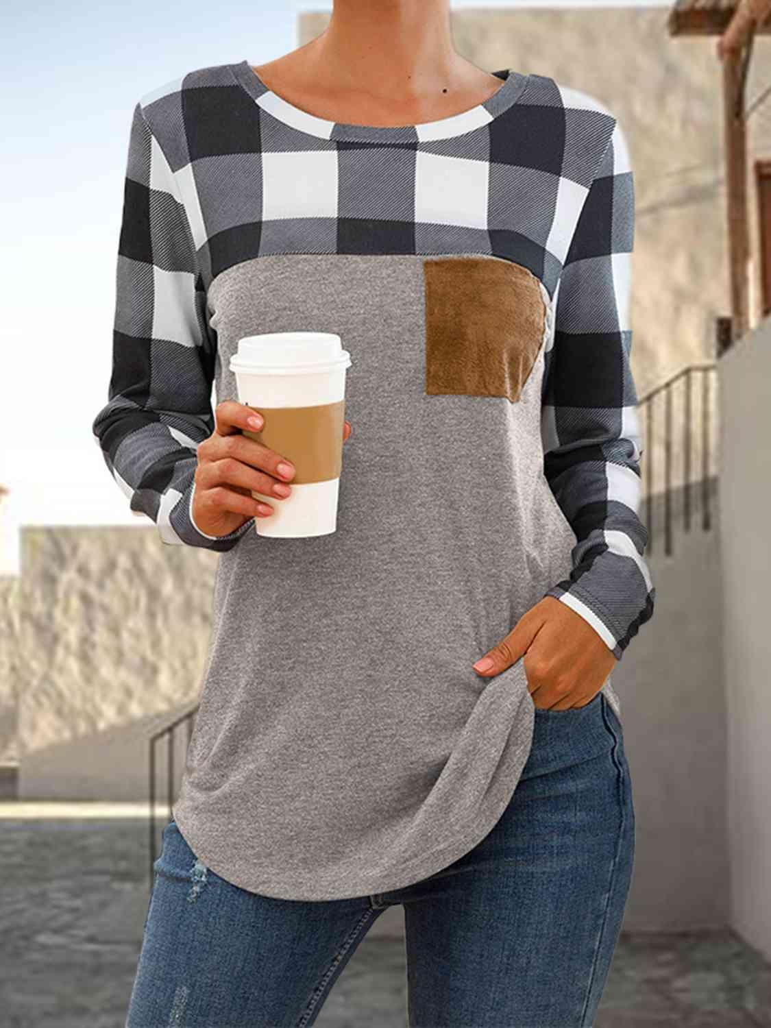 a woman is holding a cup of coffee