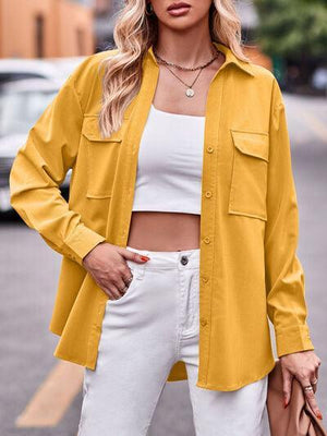 a woman wearing a yellow shirt and white pants