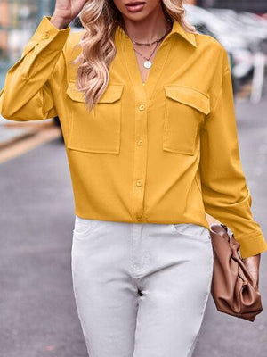 a woman wearing a yellow shirt and white pants