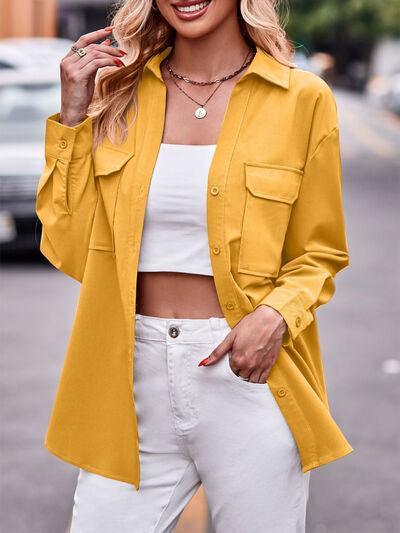 a woman wearing a yellow jacket and white pants