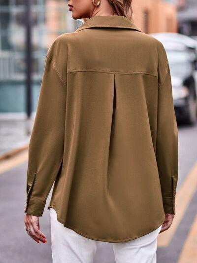 a woman walking down a street wearing a brown shirt