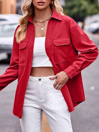 a woman wearing a red jacket and white pants