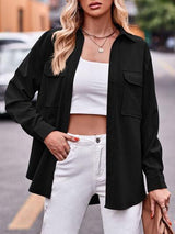 a woman wearing white pants and a black jacket