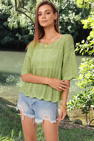 a beautiful young woman standing next to a river