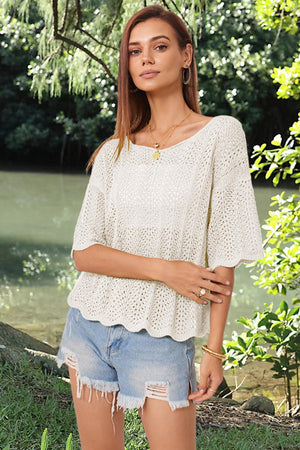 a beautiful young woman standing next to a river