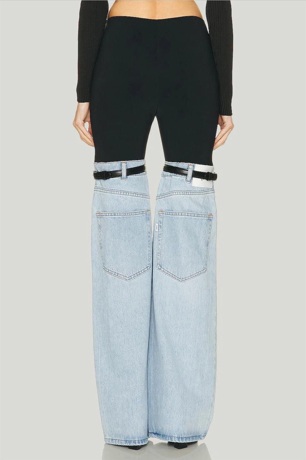 the back of a woman's jeans with a belt