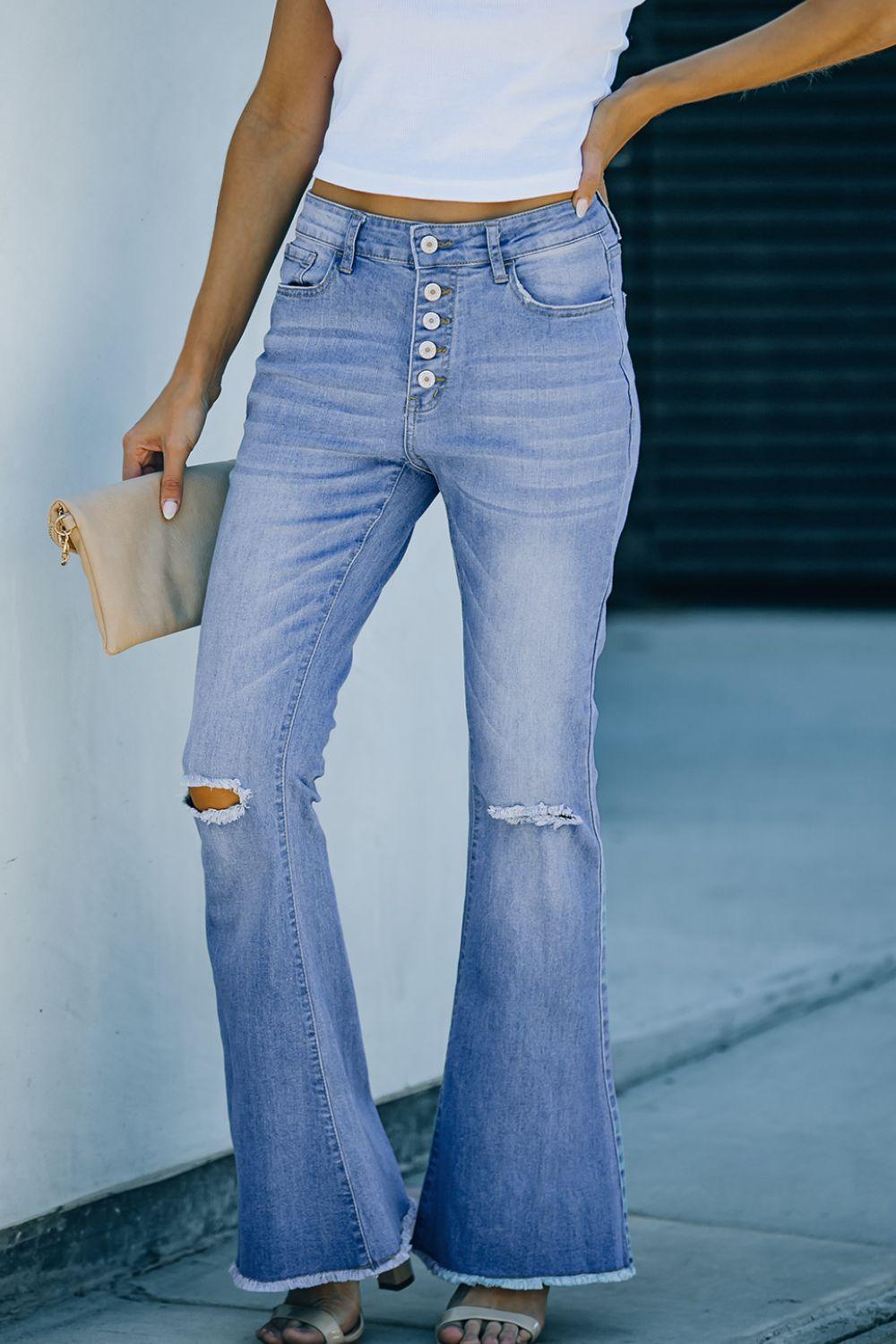 a woman in a white shirt and blue jeans