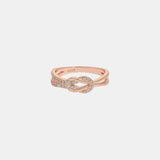 a rose gold ring with diamonds on a white background