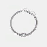 a close up of a bracelet on a white background