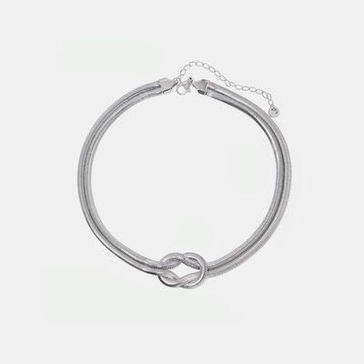 a close up of a bracelet on a white background