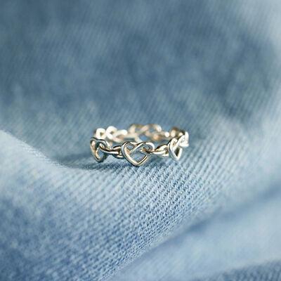 a close up of a ring on a blue cloth