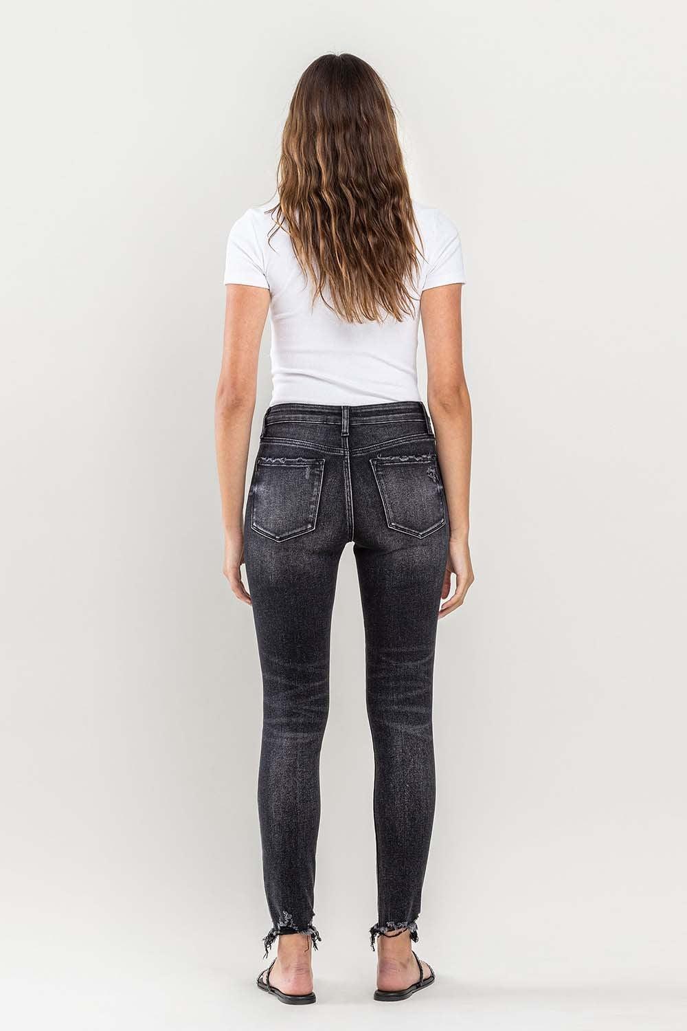 the back of a woman in black jeans