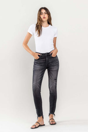 a woman in a white shirt and black jeans