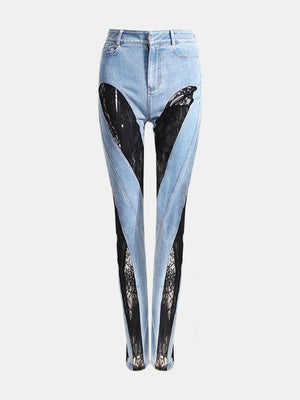 a pair of jeans with a black bird on them