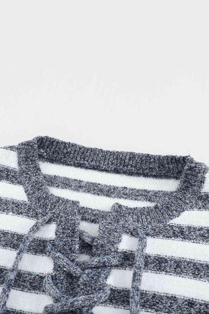 a close up of a sweater with a knot on it