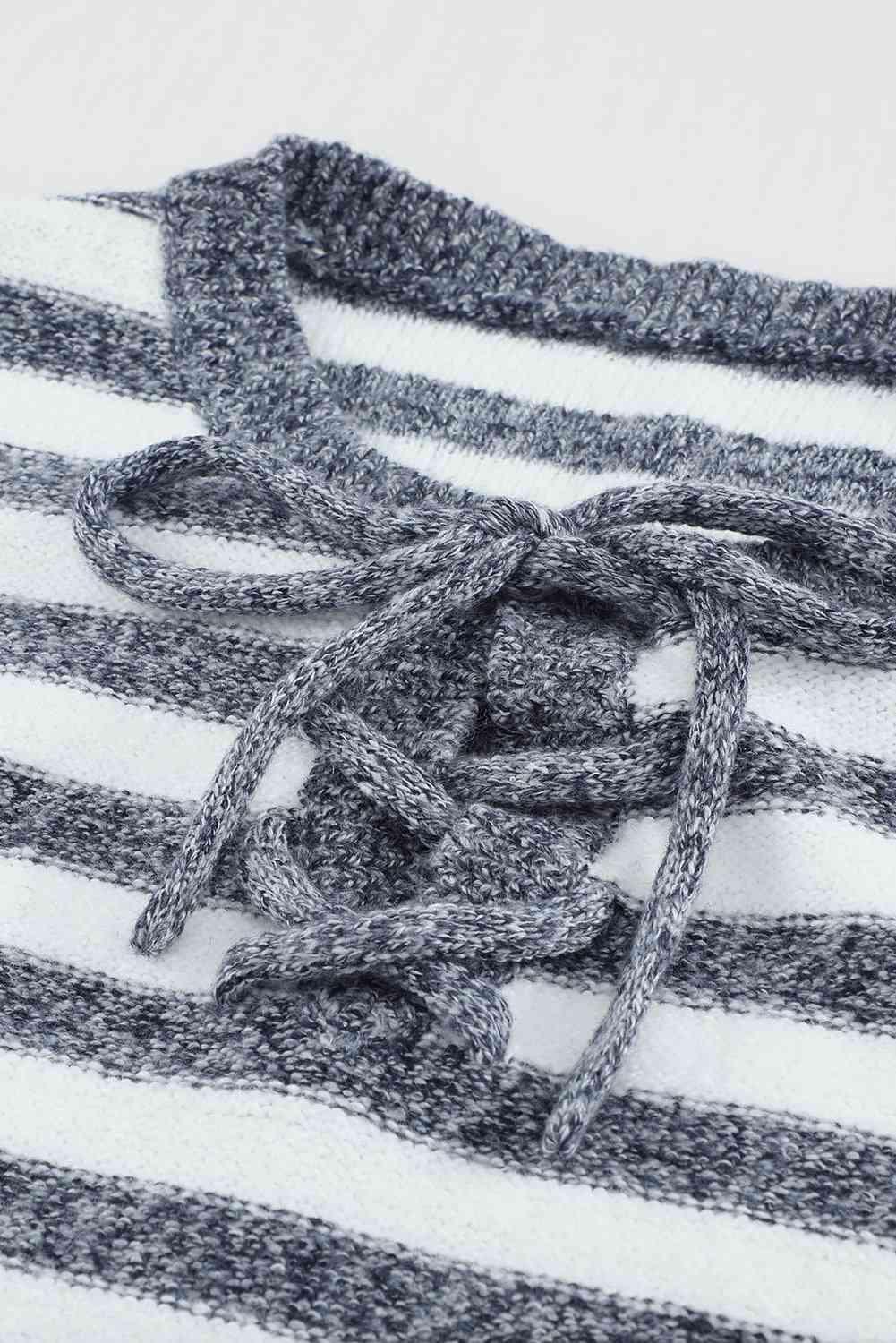 a close up of a striped shirt with a knot