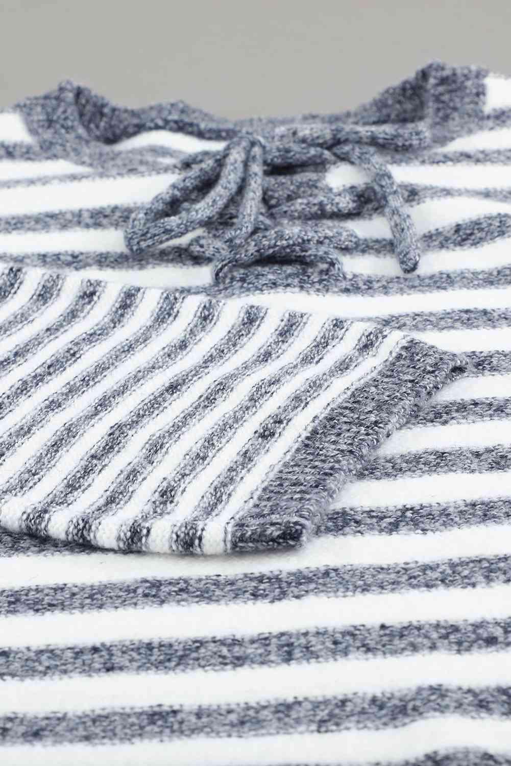 a close up of a striped shirt with a knot