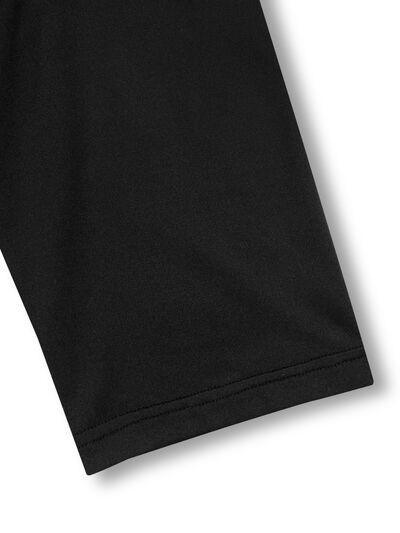 a close up of a black shirt on a white background