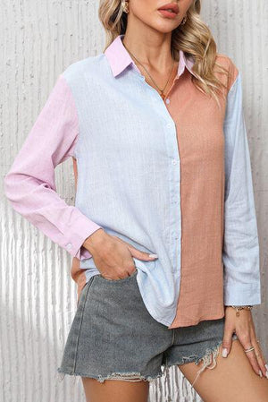 a woman wearing a pink and blue shirt