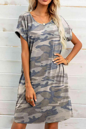 a woman wearing a camo print dress