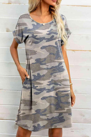 a woman wearing a camo print dress