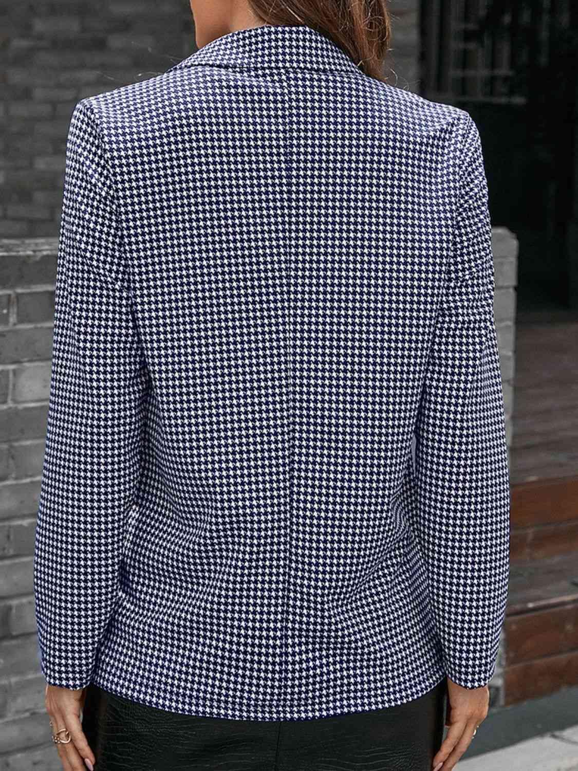 a woman wearing a blue and white checkered blazer