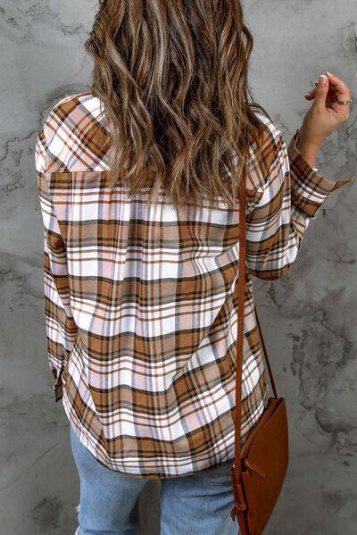 a woman with long hair wearing a plaid shirt