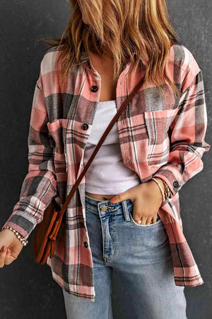 a woman wearing a plaid shirt and jeans