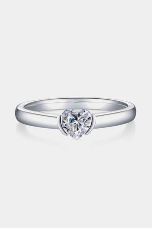 a white gold ring with a heart shaped diamond