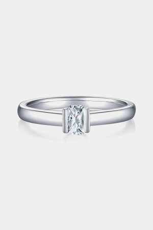 a white gold ring with a princess cut diamond