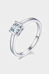 a white gold ring with a princess cut diamond